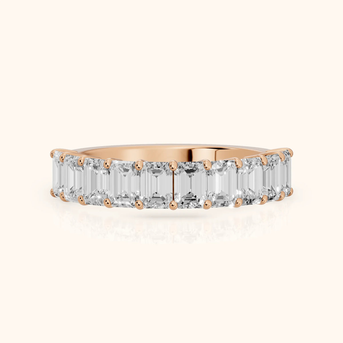 Nia Shared Prong Emerald Diamond Half Eternity Band in Rose Gold - FrontView