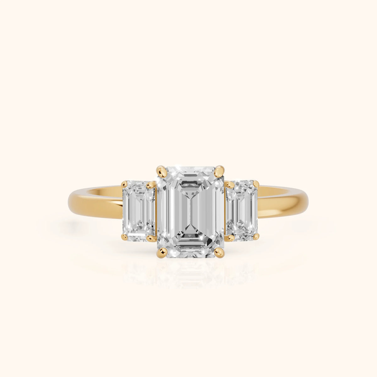 Marian Three-Stone Hidden Halo Emerald Diamond Engagement Ring in Yellow Gold - FrontView.webp