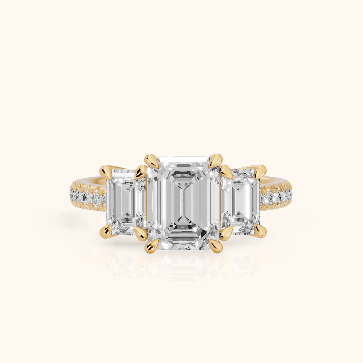 Gabrielle Three-Stone Pavé Emerald Diamond Engagement Ring in Yellow Gold - FrontView.webp