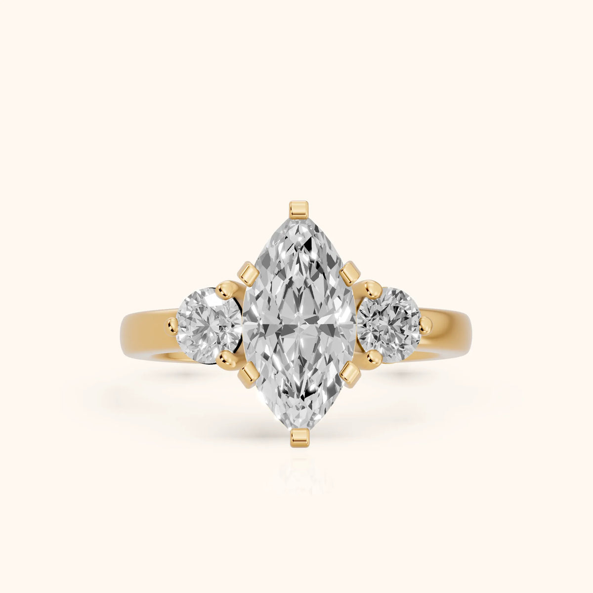 Freesia Three-Stone Marquise Diamond Engagement Ring in Yellow Gold - FrontView.webp