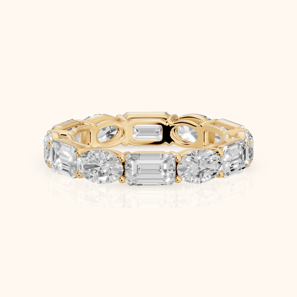 Hema Shared Prong Emerald & Oval Diamond Eternity Band in Yellow Gold - FrontView