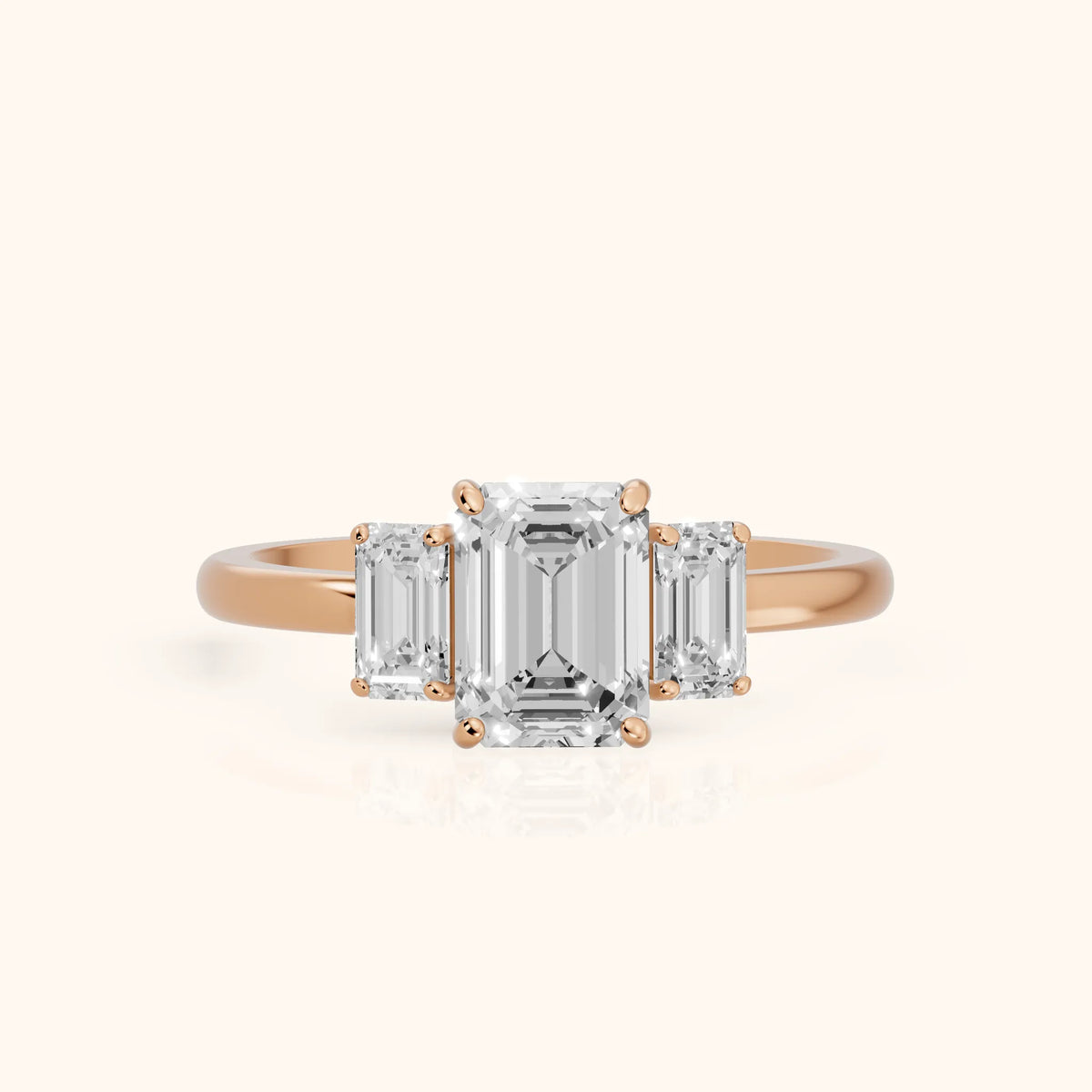Marian Three-Stone Hidden Halo Emerald Diamond Engagement Ring in Rose Gold - FrontView.webp