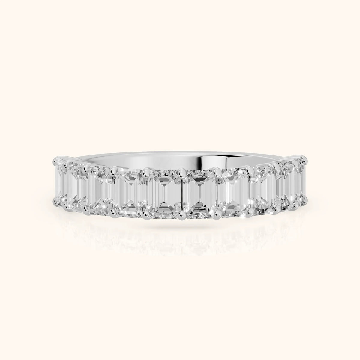 Nia Shared Prong Emerald Diamond Half Eternity Band in Platinum - FrontView