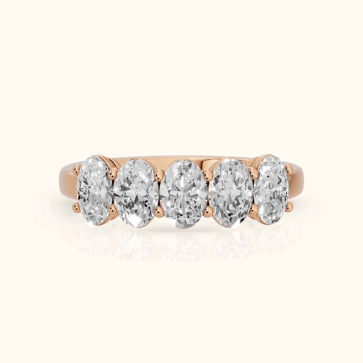 Estela Shared Prong Oval Diamond Wedding Band in Rose Gold - FrontView
