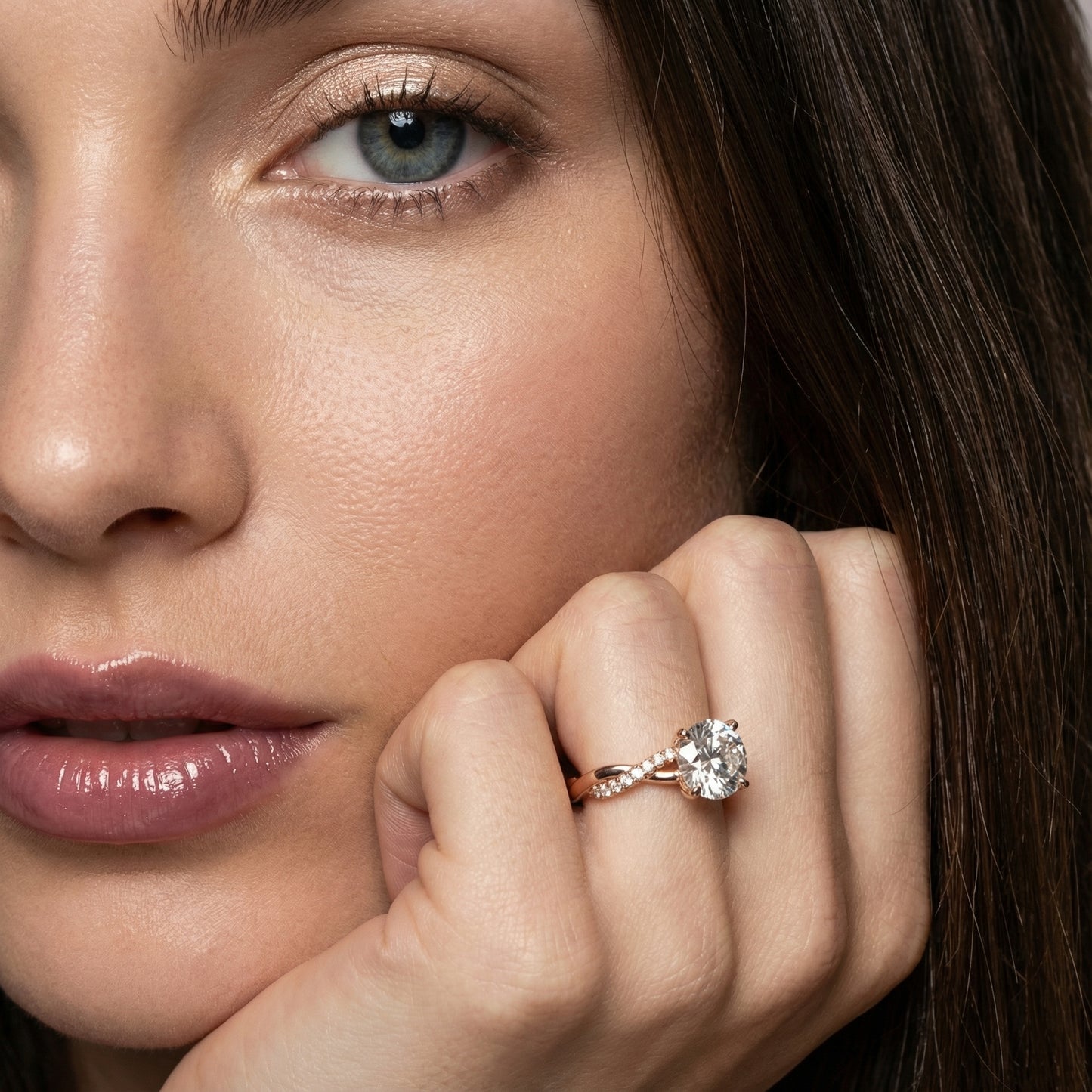 Round cut lab grown diamond twisted side stone engagement ring in rose gold