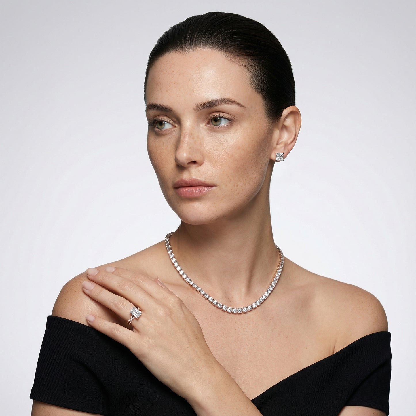 Emerald Cut Lab Grown Diamond Twisted Side Stone Engagement Ring in Rose Gold