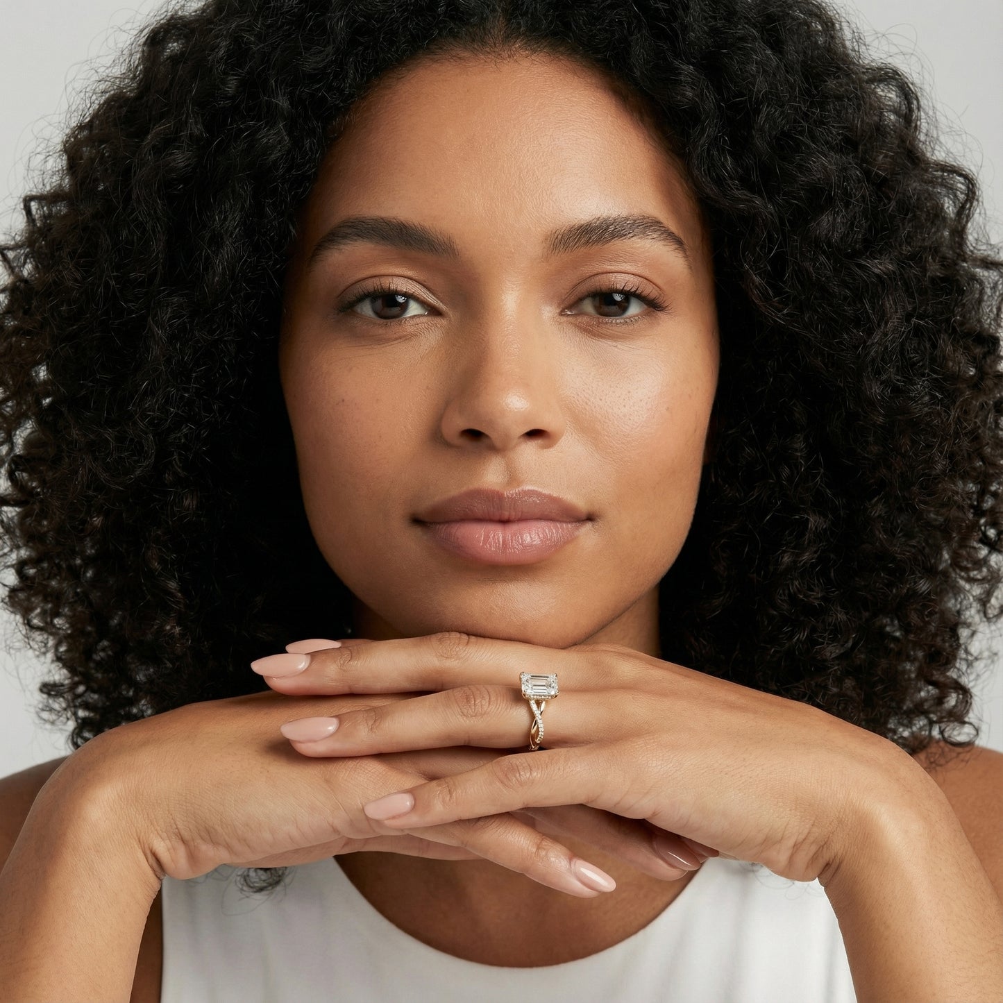 Emerald Cut Lab Grown Diamond Twisted Side Stone Engagement Ring in Yellow Gold