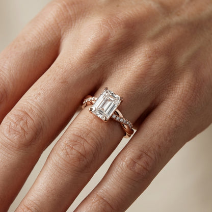 Emerald Cut Lab Grown Diamond Twisted Side Stone Engagement Ring in Rose Gold