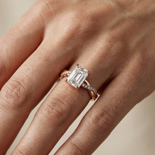 Emerald Cut Lab Grown Diamond Twisted Side Stone Engagement Ring in Rose Gold