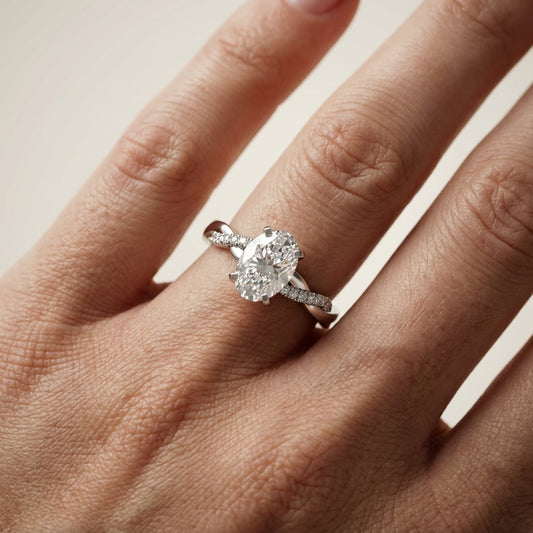 Oval Cut Lab Grown Diamond Twisted Side Stone Engagement Ring in Platinum