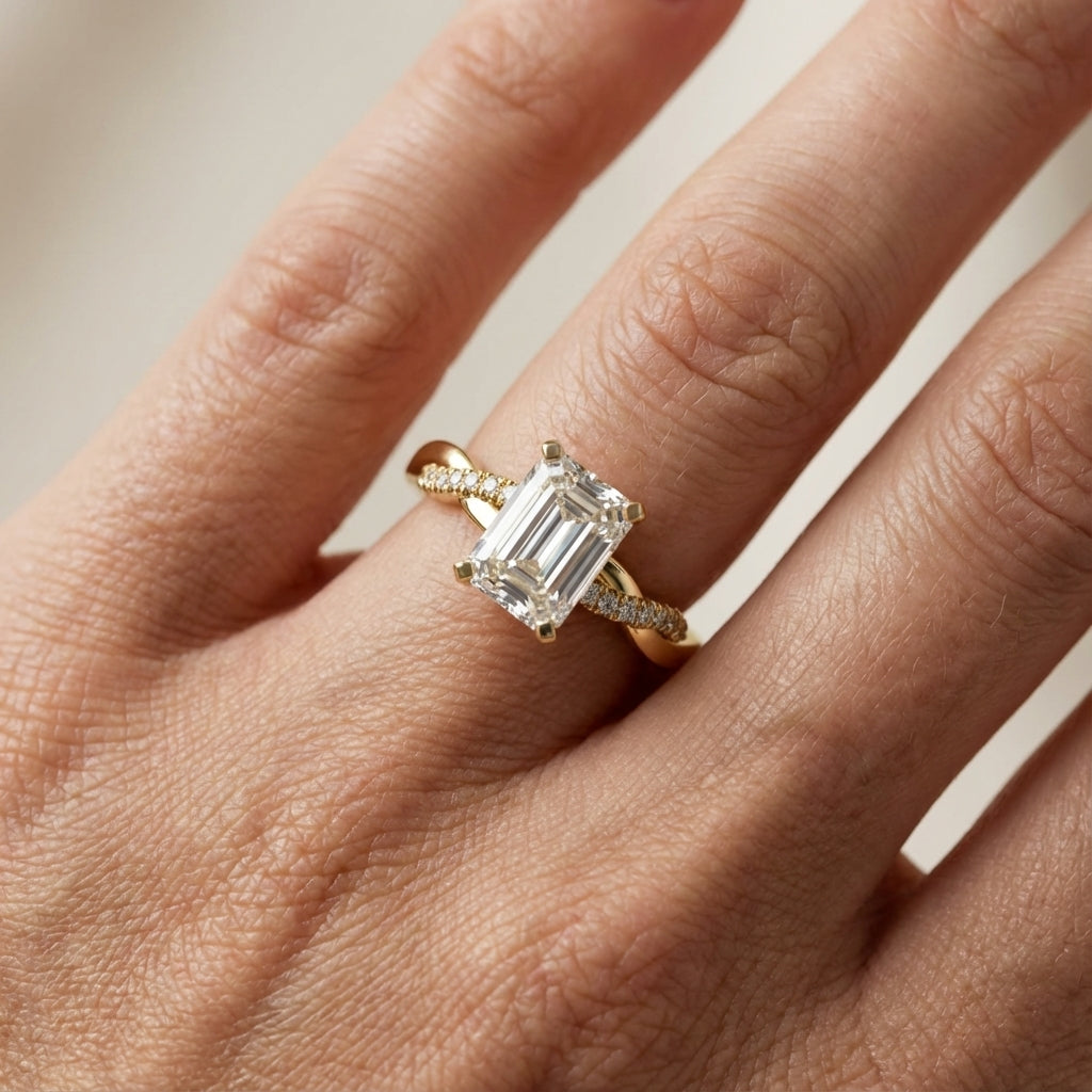 Emerald Cut Lab Grown Diamond Twisted Side Stone Engagement Ring in Yellow Gold