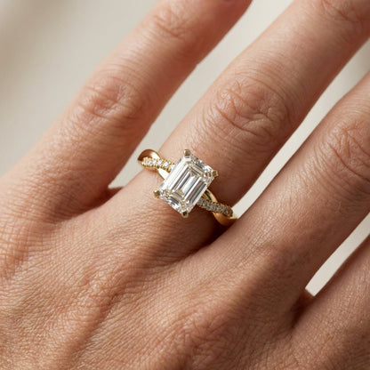 Emerald Cut Lab Grown Diamond Twisted Side Stone Engagement Ring in Yellow Gold