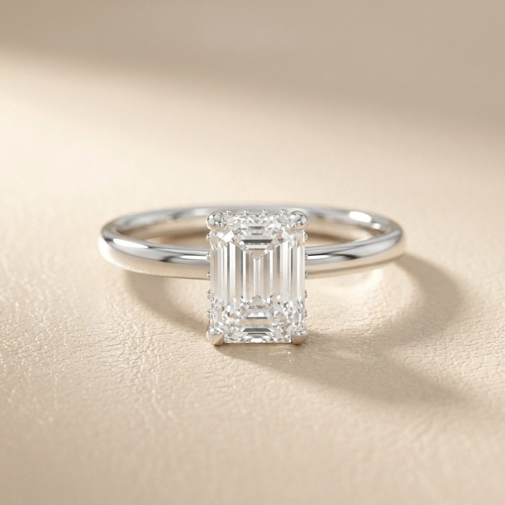 Emerald Cut Lab Grown Diamond Solitaire Engagement Ring in White Gold with four claw prongs