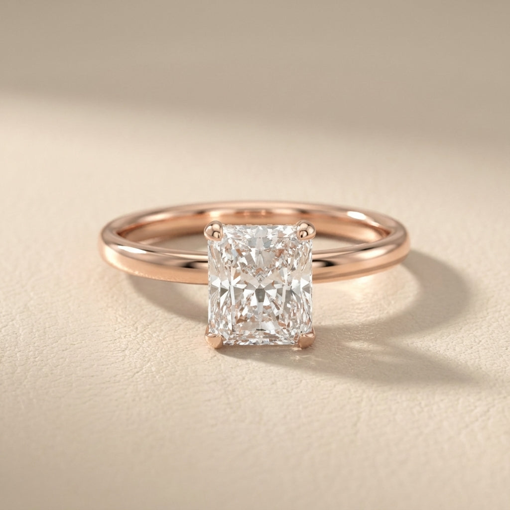 Charlotte Charm Radiant Cut Lab Grown Diamond Solitaire Engagement Ring in Rose Gold showing side profile and hidden halo.