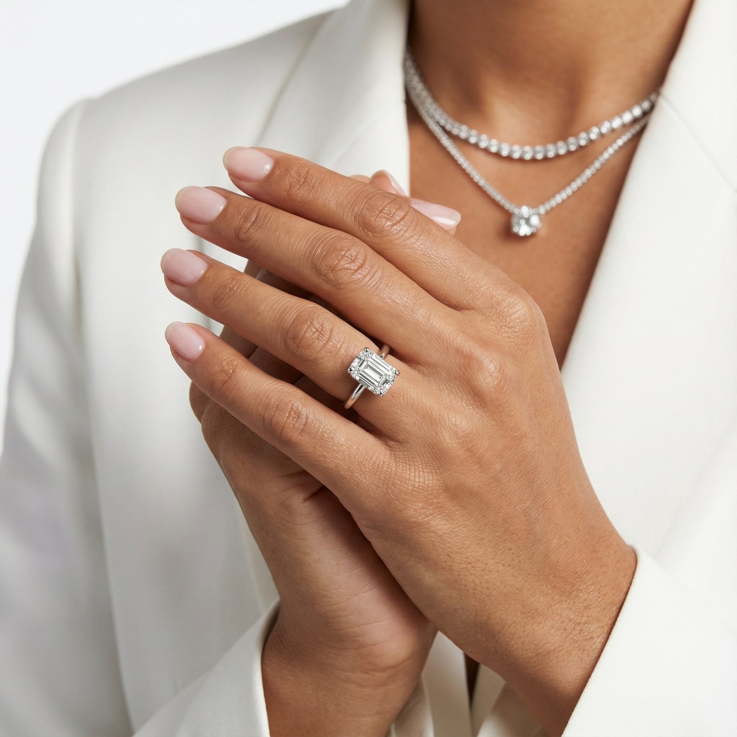 Emerald Cut Lab Grown Diamond Solitaire Engagement Ring in Platinum showing the hidden diamond basket