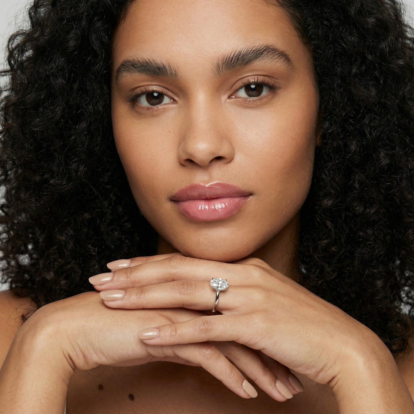 Oval Cut Lab Grown Diamond Solitaire Engagement Ring in Platinum showing hidden collar