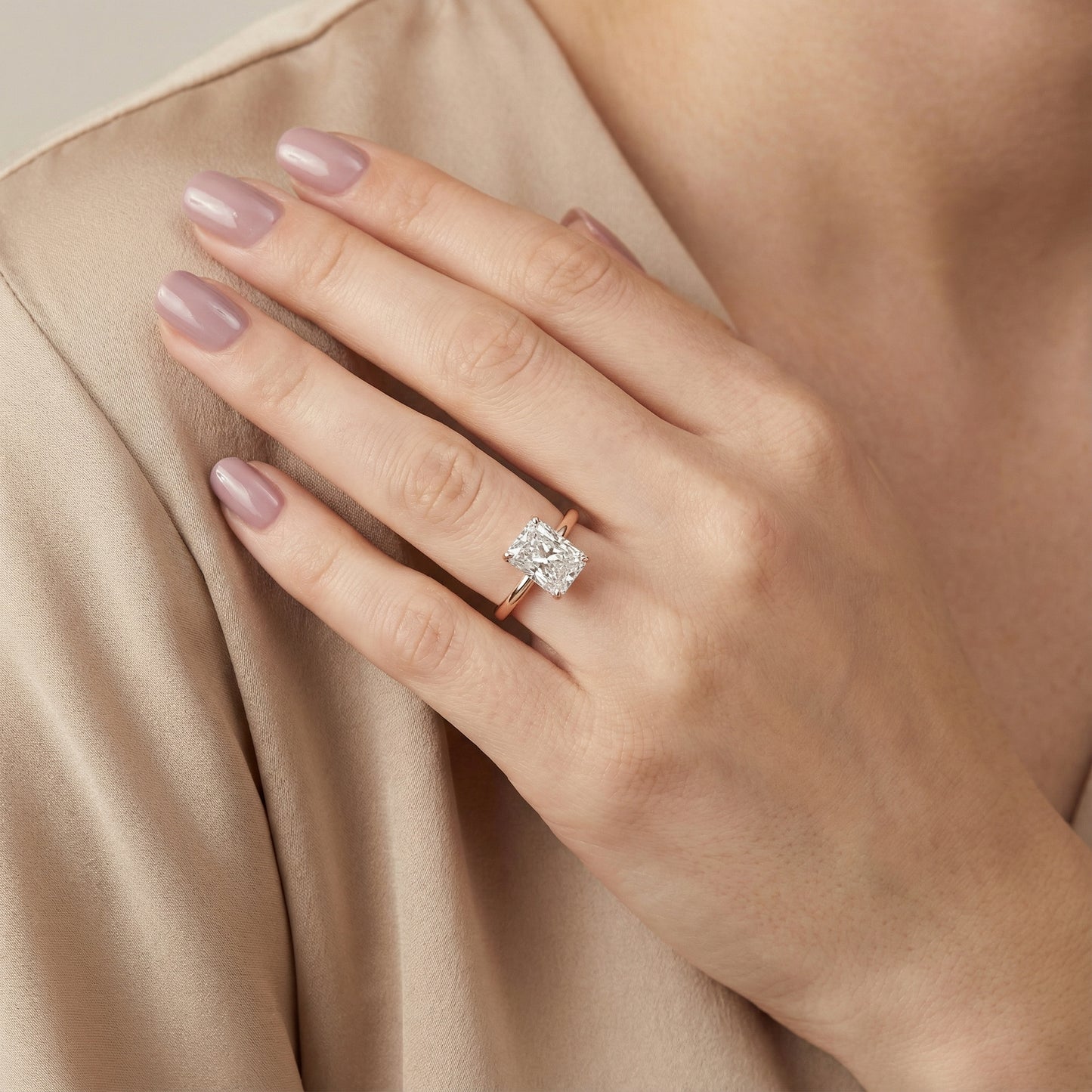 Charlotte Charm Radiant Cut Lab Grown Diamond Solitaire Engagement Ring in Rose Gold showing side profile and hidden halo.