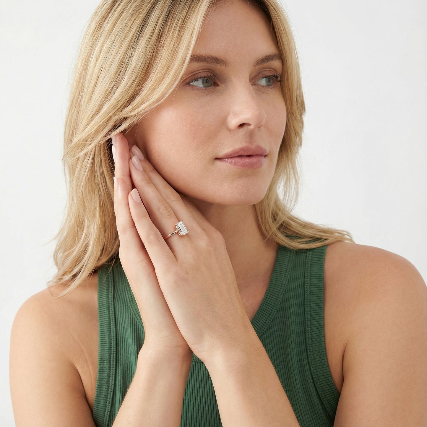 Emerald Cut Lab Grown Diamond Solitaire Engagement Ring in Rose Gold showing side profile with hidden accents