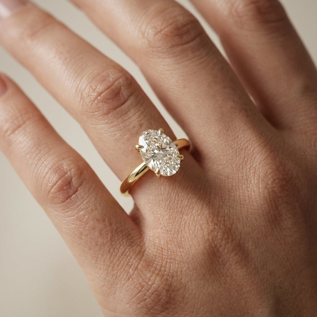 Oval Cut Lab Grown Diamond Solitaire Engagement Ring in Yellow Gold with four claws