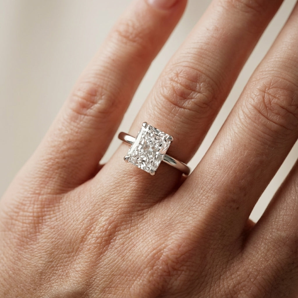 Charlotte Charm Radiant Cut Lab Grown Diamond Solitaire Engagement Ring in Platinum showing hidden details under the center stone.