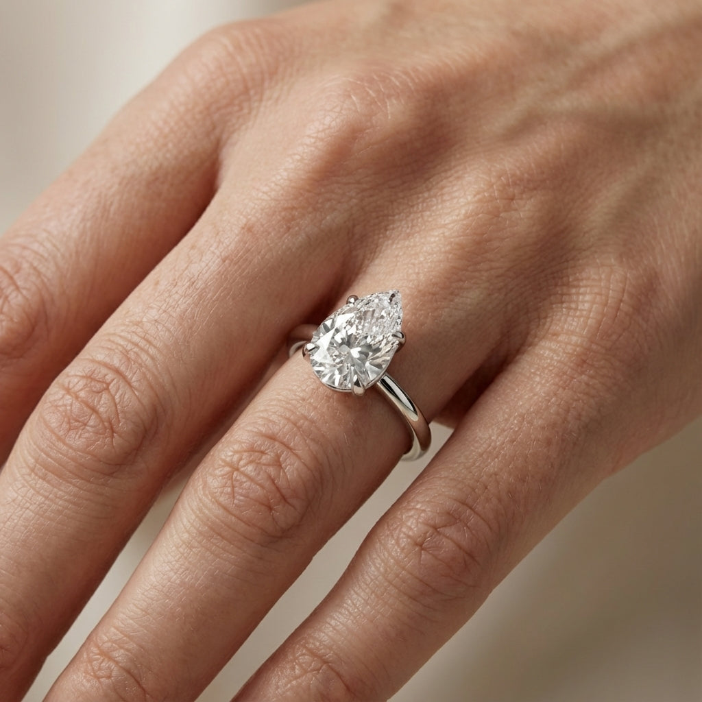 Pear Cut Lab Grown Diamond Solitaire Engagement Ring in Silver with hidden accents