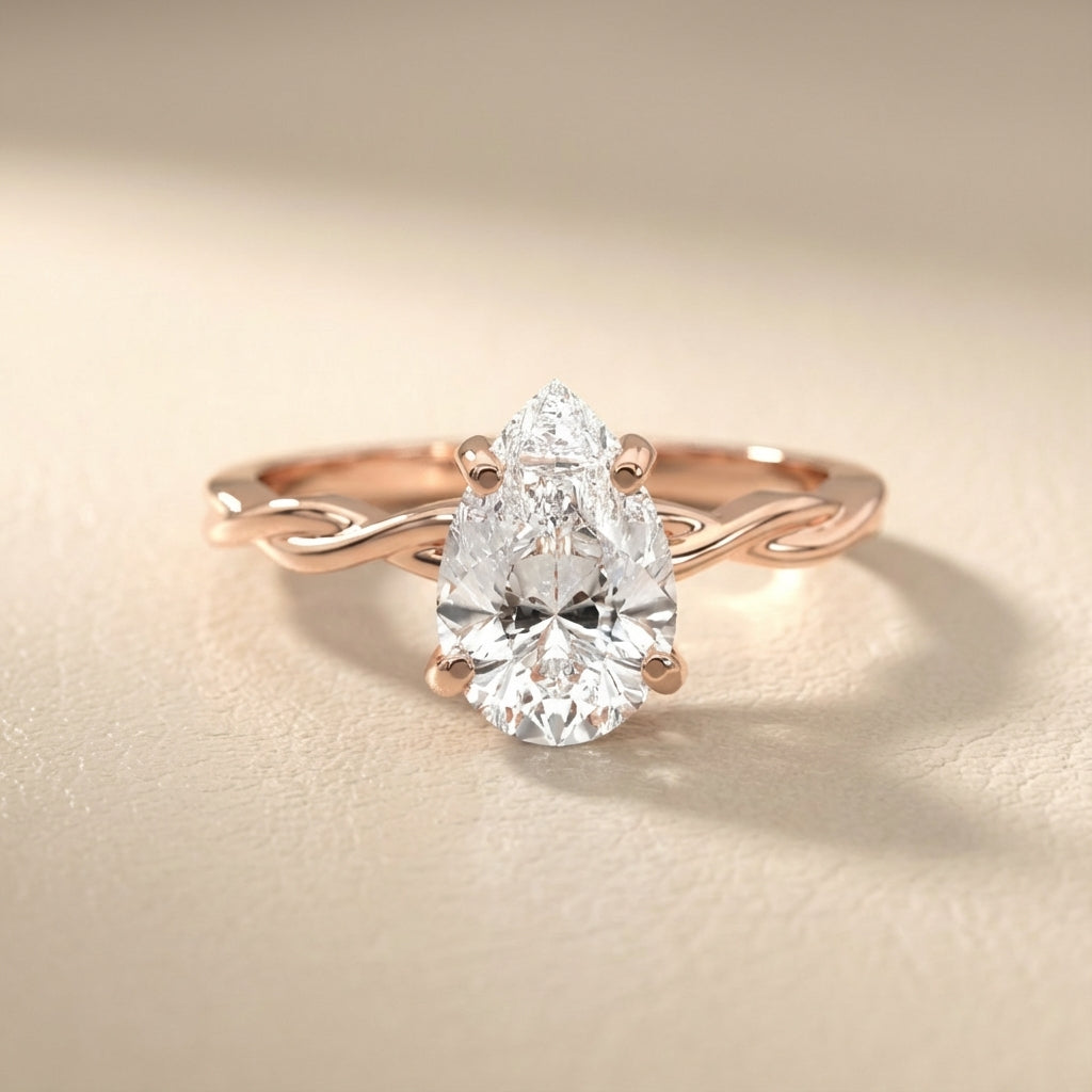 Pear Cut Lab Grown Diamond Solitaire Engagement Ring with Twisted Shank in Rose Gold