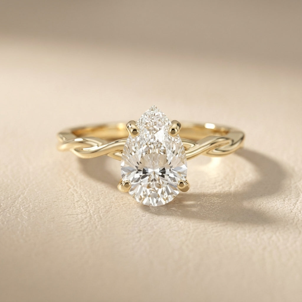 Pear Cut Lab Grown Diamond Solitaire Engagement Ring with Twisted Shank in Yellow Gold