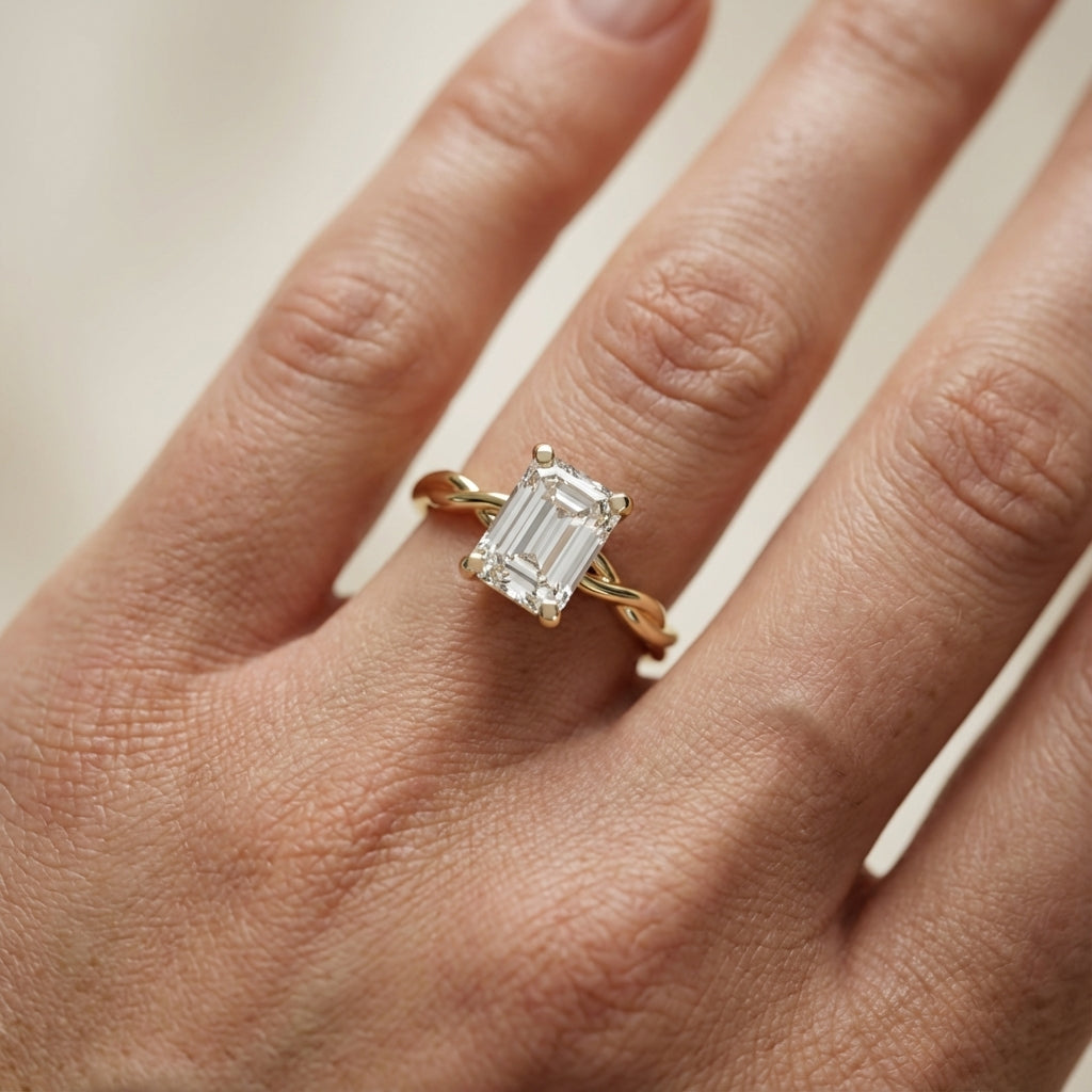 Emerald Cut Lab Grown Diamond Engagement Ring with Twisted Shank in Yellow Gold