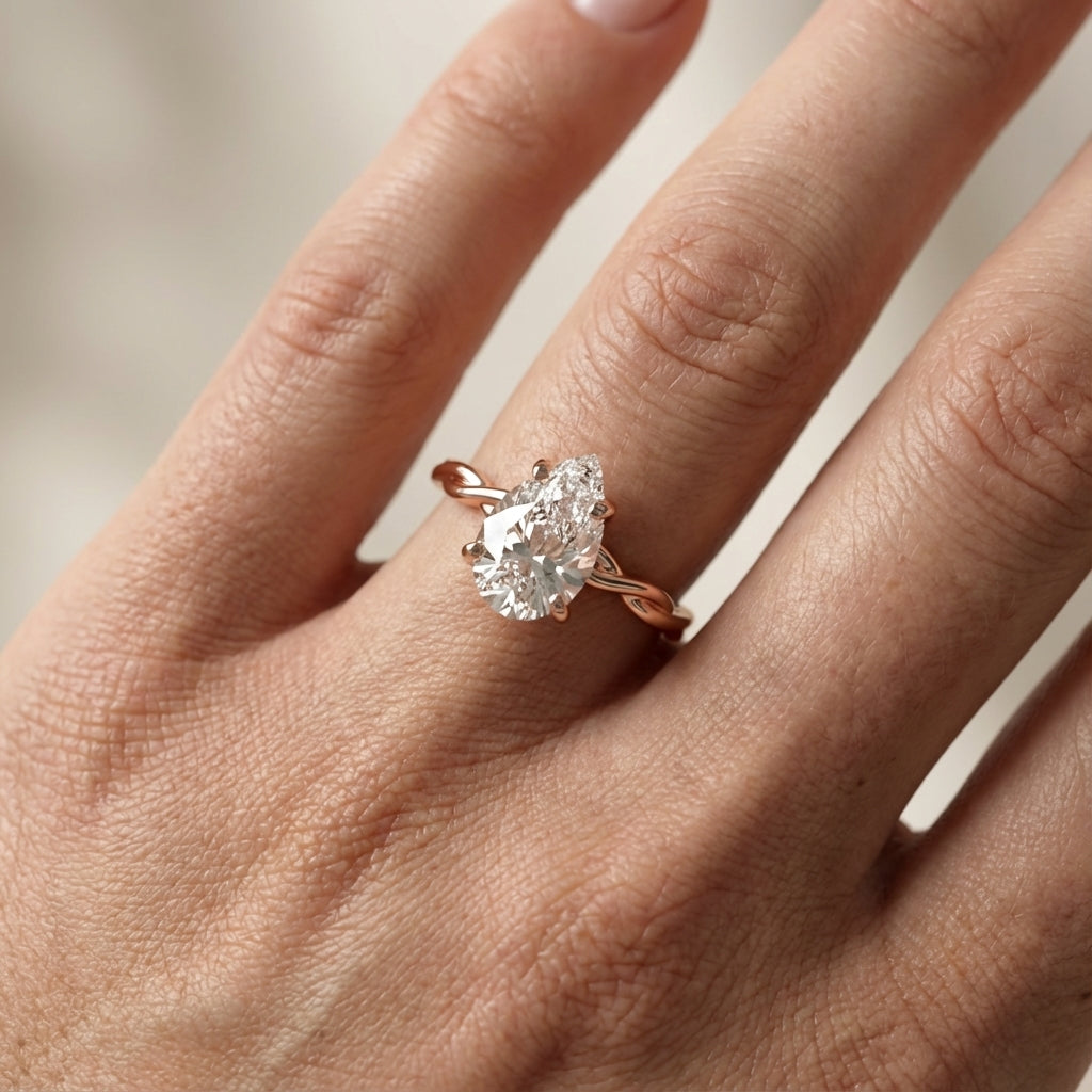 Pear Cut Lab Grown Diamond Solitaire Engagement Ring with Twisted Shank in Rose Gold