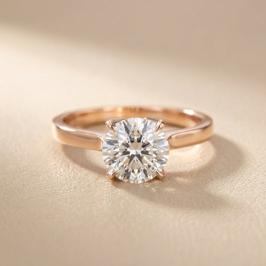 Round cut lab grown diamond solitaire engagement ring in rose gold with floral basket setting