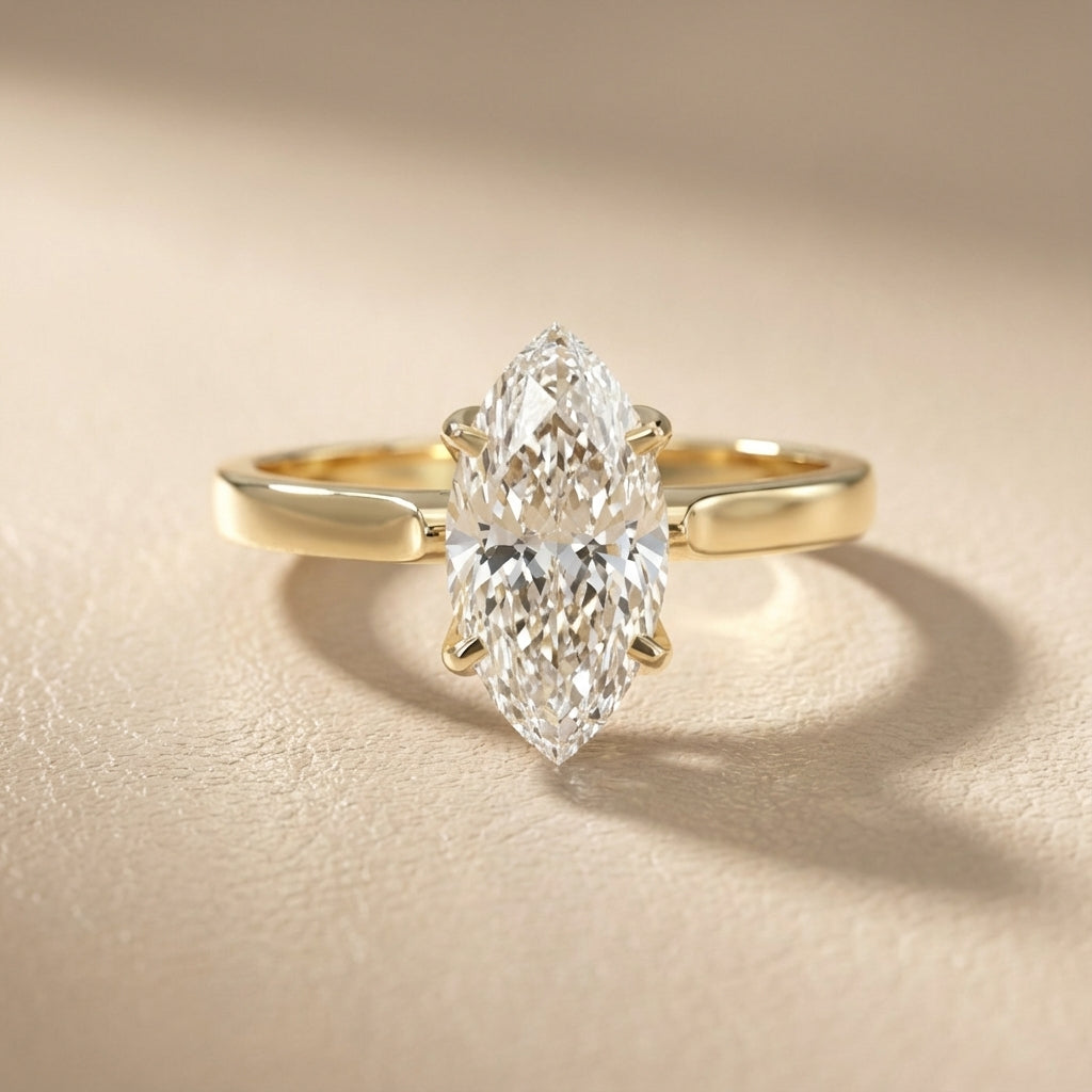 Marquise cut lab grown diamond solitaire engagement ring in rich yellow gold setting.