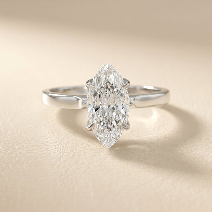 Marquise cut lab grown diamond solitaire engagement ring in highly polished white gold setting.