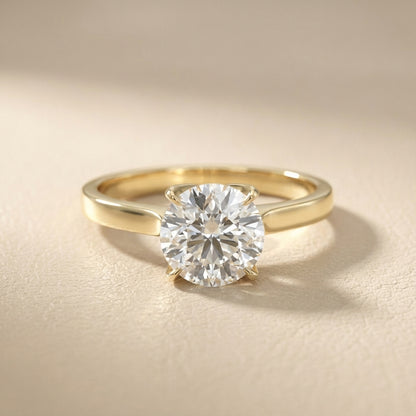 Round cut lab grown diamond solitaire engagement ring in yellow gold with floral basket setting