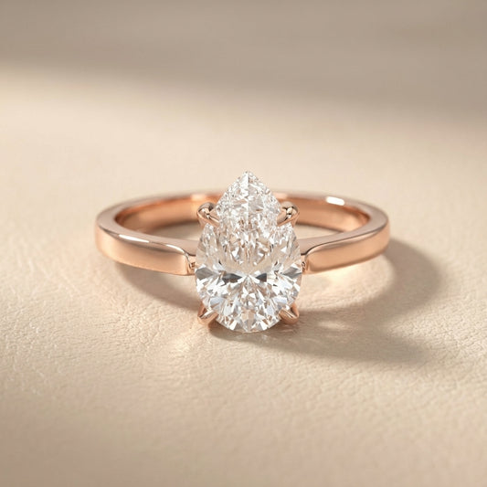 Pear Cut Lab Grown Diamond Solitaire Engagement Ring in Rose Gold showing floral prong details
