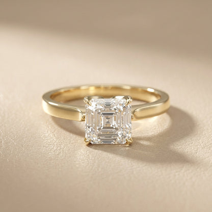 Asscher Cut Lab Grown Diamond Solitaire Engagement Ring in Yellow Gold with cathedral setting.