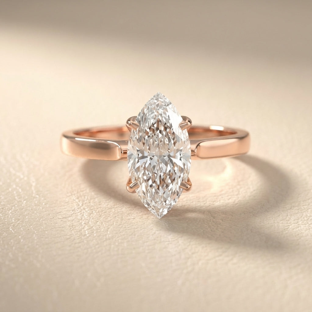 Marquise cut lab grown diamond solitaire engagement ring in warm rose gold floral setting.