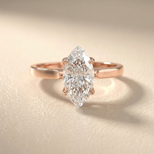 Marquise cut lab grown diamond solitaire engagement ring in warm rose gold floral setting.