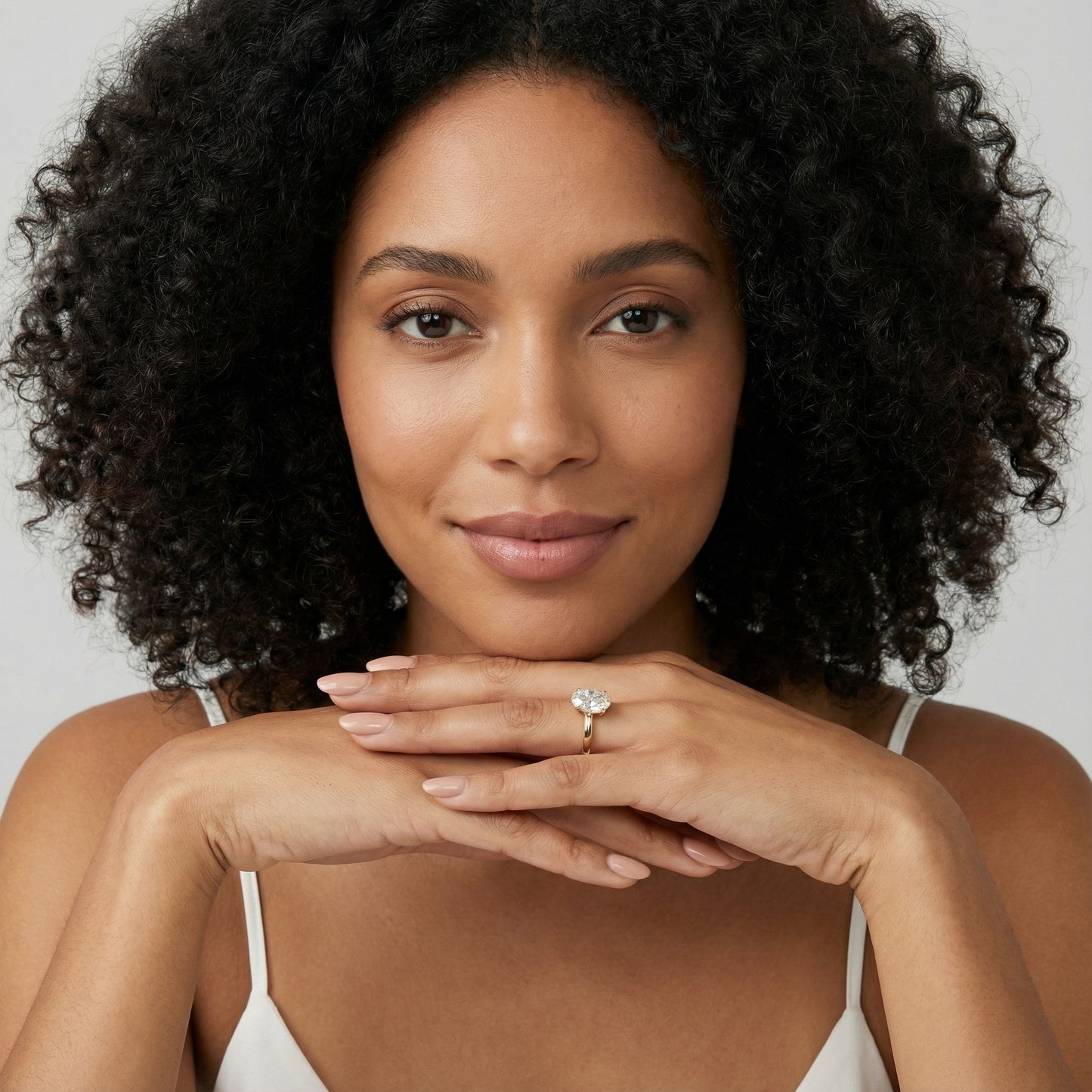 Oval Cut Lab Grown Diamond Solitaire Engagement Ring in Yellow Gold showing detailed petal prongs