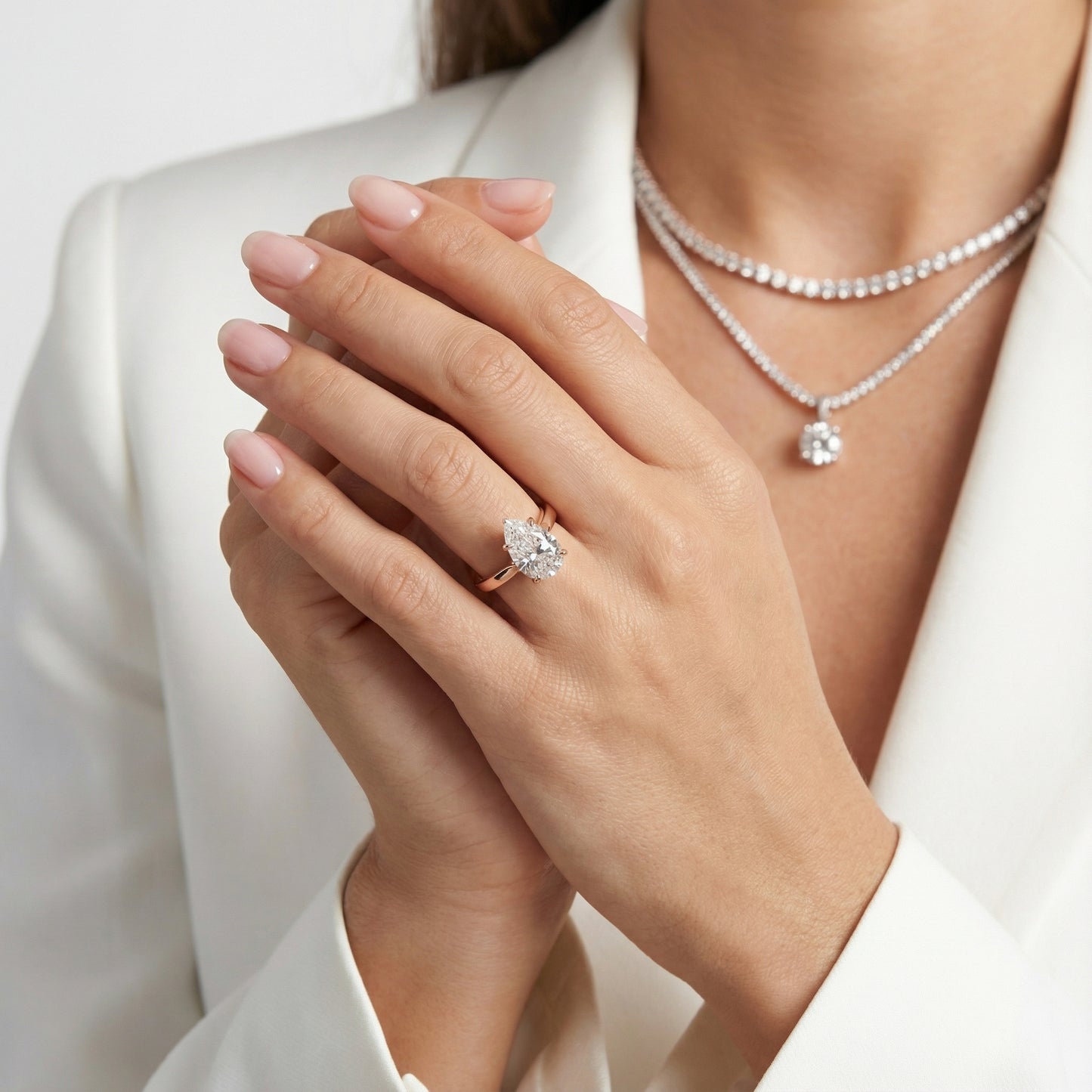 Pear Cut Lab Grown Diamond Solitaire Engagement Ring in Rose Gold showing floral prong details