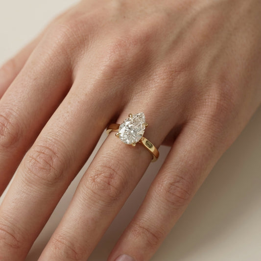 Pear Cut Lab Grown Diamond Solitaire Engagement Ring in Yellow Gold side profile view