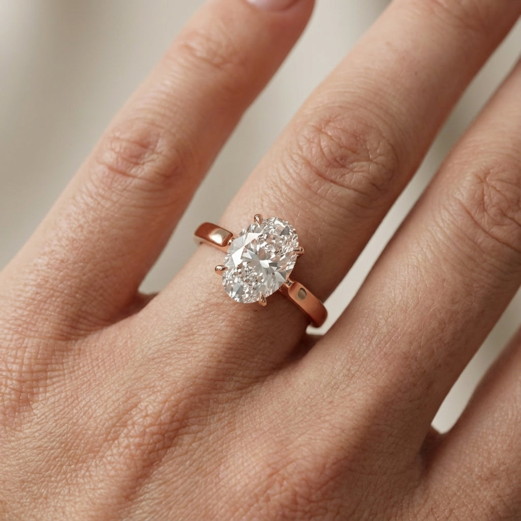 Oval Cut Lab Grown Diamond Solitaire Engagement Ring in Rose Gold showing side profile and setting