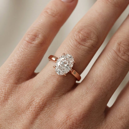 Oval Cut Lab Grown Diamond Solitaire Engagement Ring in Rose Gold showing side profile and setting