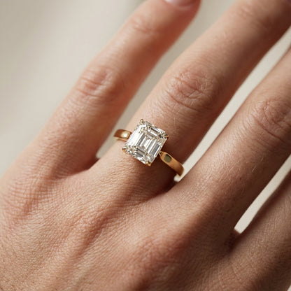 Asscher Cut Lab Grown Diamond Solitaire Engagement Ring in Yellow Gold with cathedral setting.