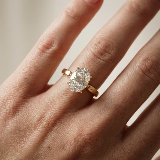 Oval Cut Lab Grown Diamond Solitaire Engagement Ring in Yellow Gold showing detailed petal prongs