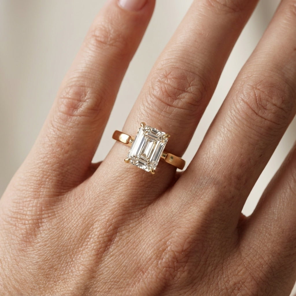 Emerald Cut Lab Grown Diamond Solitaire Engagement Ring in Yellow Gold with Floral Basket Setting