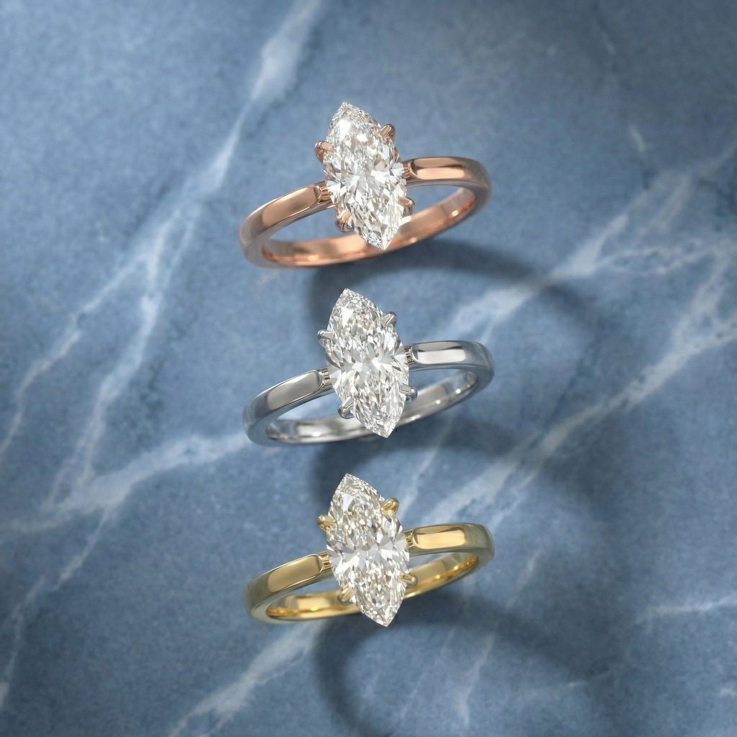 Marquise cut lab grown diamond solitaire engagement ring in warm rose gold floral setting.