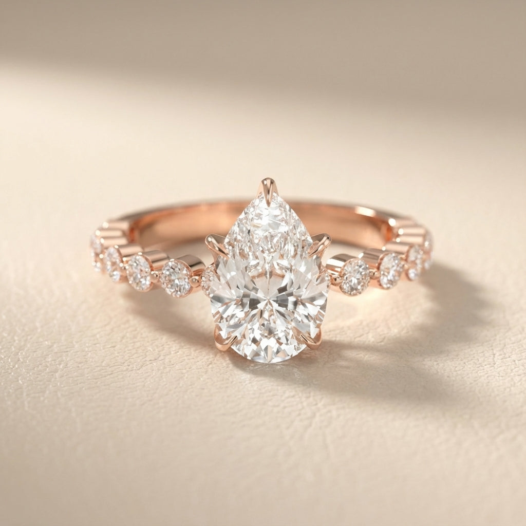 Pear Cut Lab Grown Diamond Engagement Ring with floating side stones in Rose Gold