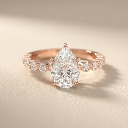 Pear Cut Lab Grown Diamond Engagement Ring with floating side stones in Rose Gold