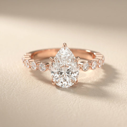 Pear Cut Lab Grown Diamond Engagement Ring with floating side stones in Rose Gold