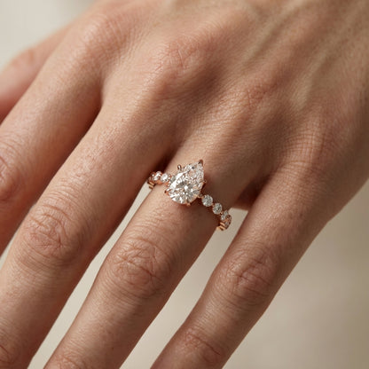 Pear Cut Lab Grown Diamond Engagement Ring with floating side stones in Rose Gold